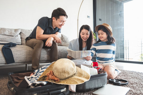 Family packing suitcases