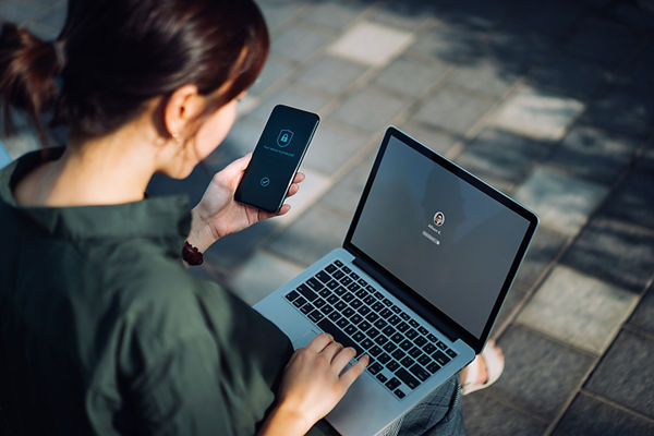 Woman on laptop protecting her identity
