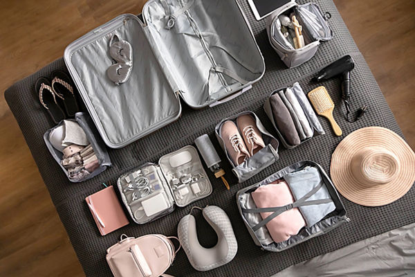 Overhead view of clothes and travel accessories