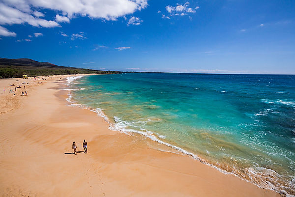 Couple walking on beach in Maui, Hawaii