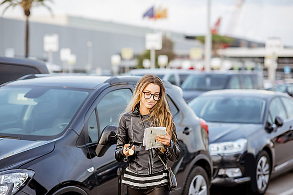 Woman renting a car