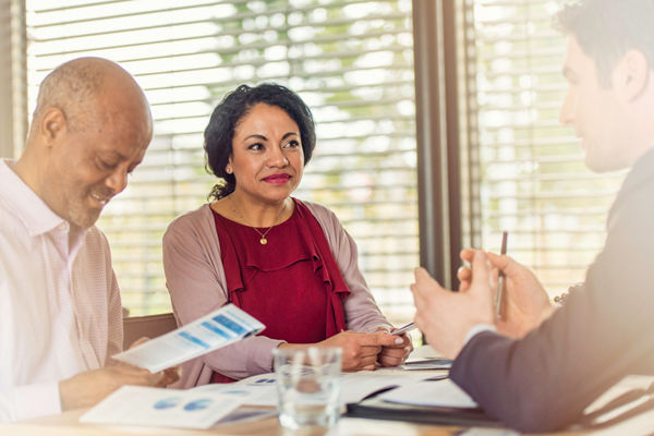 Insurance agent talking to couple